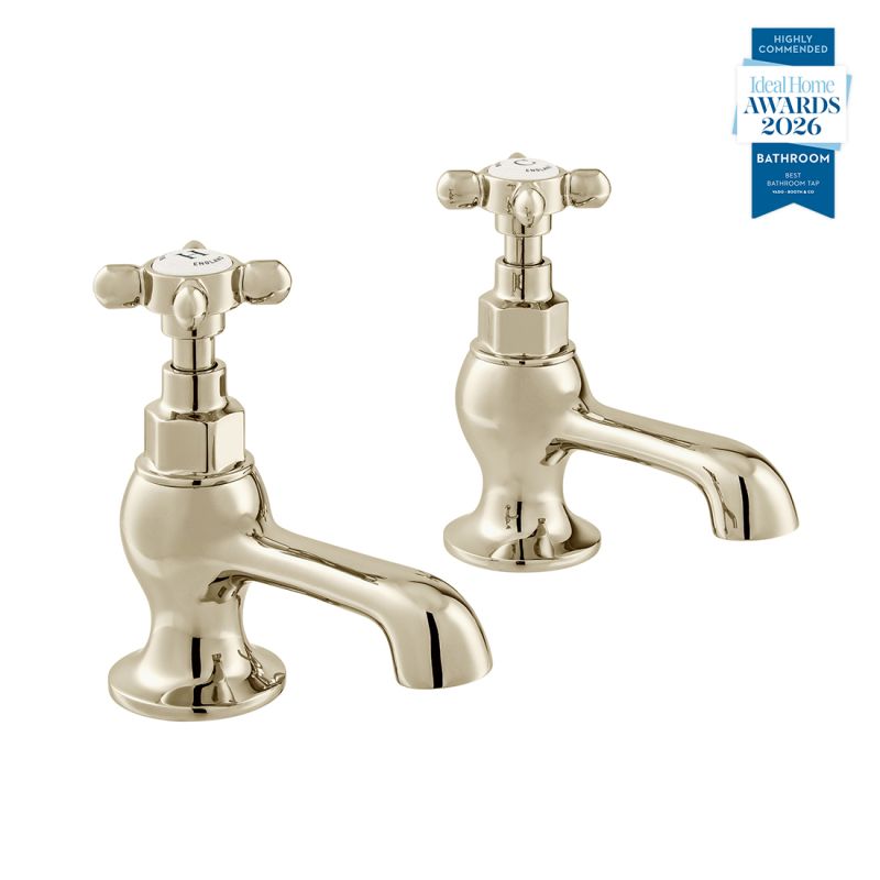 Booth & Co. Axbridge basin pillar taps with cross handles, finished in a high-shine bright nickel with crackled off-white ceramic accents.