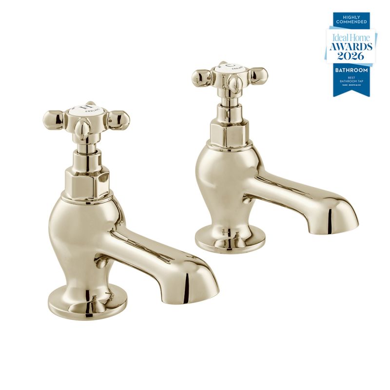 Booth & Co. Axbridge bath pillar taps with cross handles, finished in a high-shine bright nickel with crackled off-white ceramic accents.