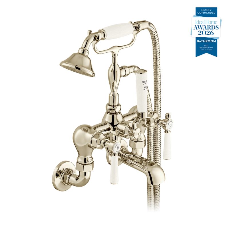 Booth & Co. Axbridge wall mounted bath shower mixer tap with shower kit and lever handles, finished in a high-shine bright nickel with crackled off-white ceramic accents.