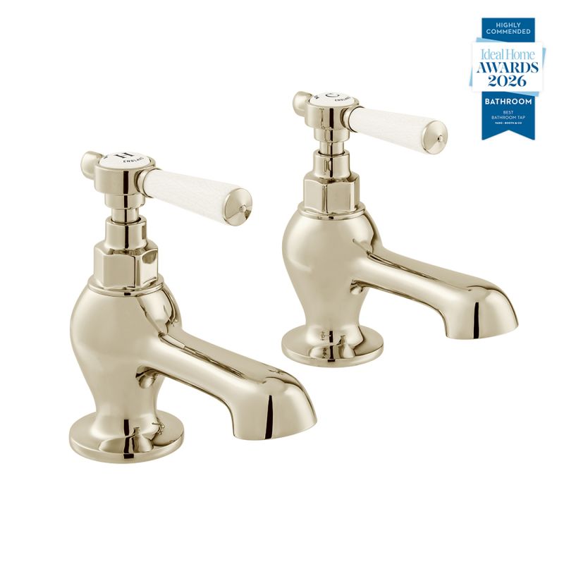 Booth & Co. Axbridge bath pillar taps with lever handles, finished in a high-shine bright nickel with crackled off-white ceramic accents.