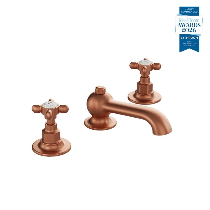 Booth & Co. Axbridge basin mixer tap with a pop up basin waste and cross handles, finished in brushed brass with black ceramic accents.