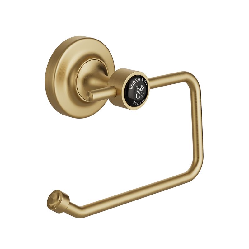 Booth & Co. toilet roll holder, finished in brushed brass with black ceramic accents. Booth & Co. toilet roll holder, finished in brushed brass with black ceramic accents.