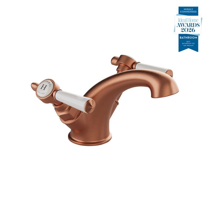Booth & Co. Axbridge Mono basin mixer tap smooth body with lever handles, finished in brushed brass with black ceramic.