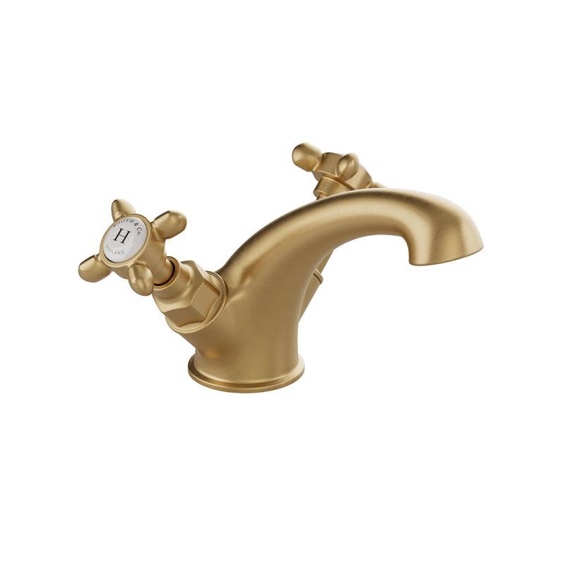 Booth & Co. Axbridge Mono basin mixer tap smooth body with cross handles, finished in brushed brass with crackled off-white ceramic accents.