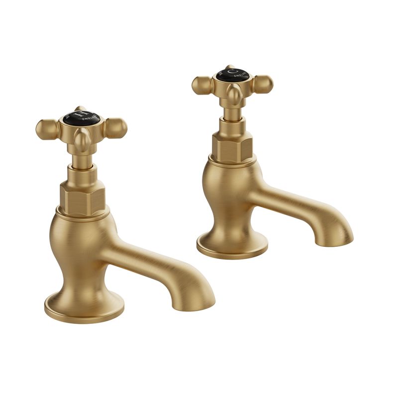 Booth & Co. Axbridge basin pillar taps with cross handles, finished in brushed brass with crackled off-white ceramic accents.