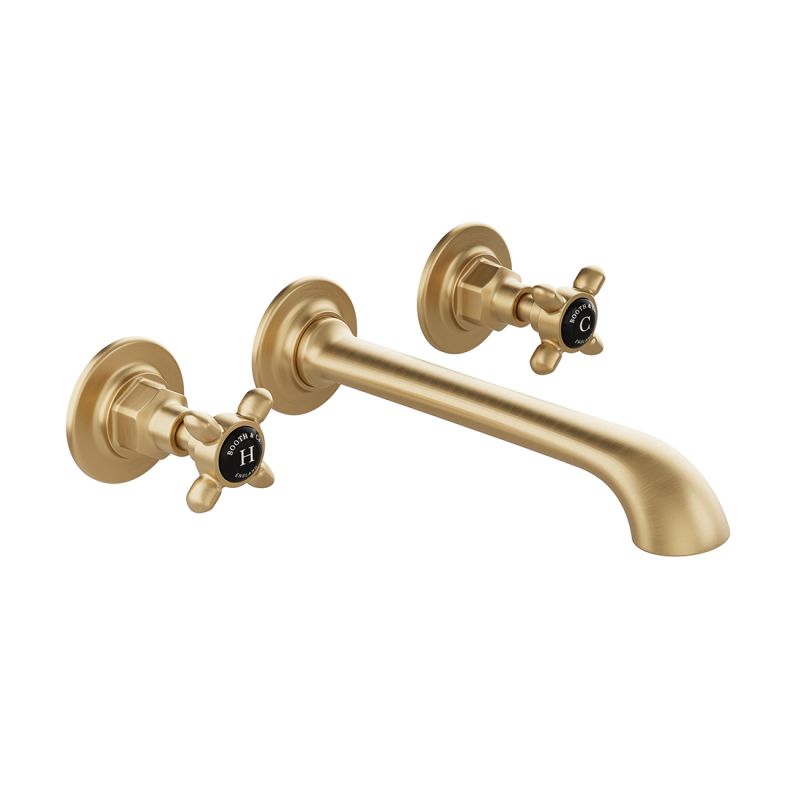 Booth & Co. Axbridge wall mounted basin mixer tap with cross handles, finished in brushed brass with crackled off-white ceramic accents.