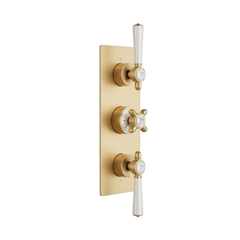 Booth & Co. Axbridge 2 outlet, 3 handle concealed thermostatic shower valve, finished in brushed brass with crackled off-white ceramic accents.