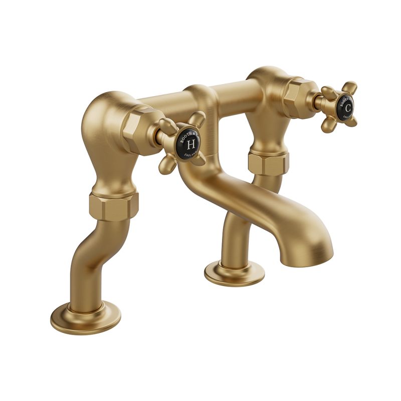 Booth & Co. Axbridge bath filler tap with cross handles, finished in brushed brass with black ceramic accents.