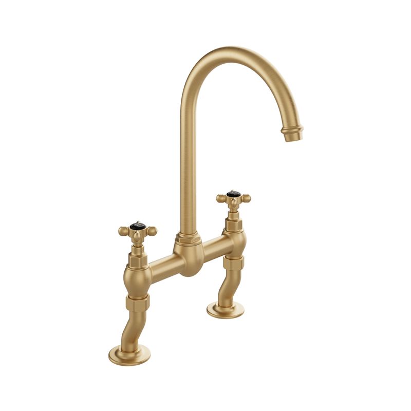 Booth & Co. Axbridge bridge kitchen tap mixer with cross handles, finished in brushed brass with black ceramic accents.