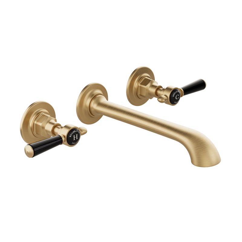 Booth & Co. Axbridge wall mounted basin mixer tap with lever handles, finished in brushed brass with crackled off-white ceramic accents.