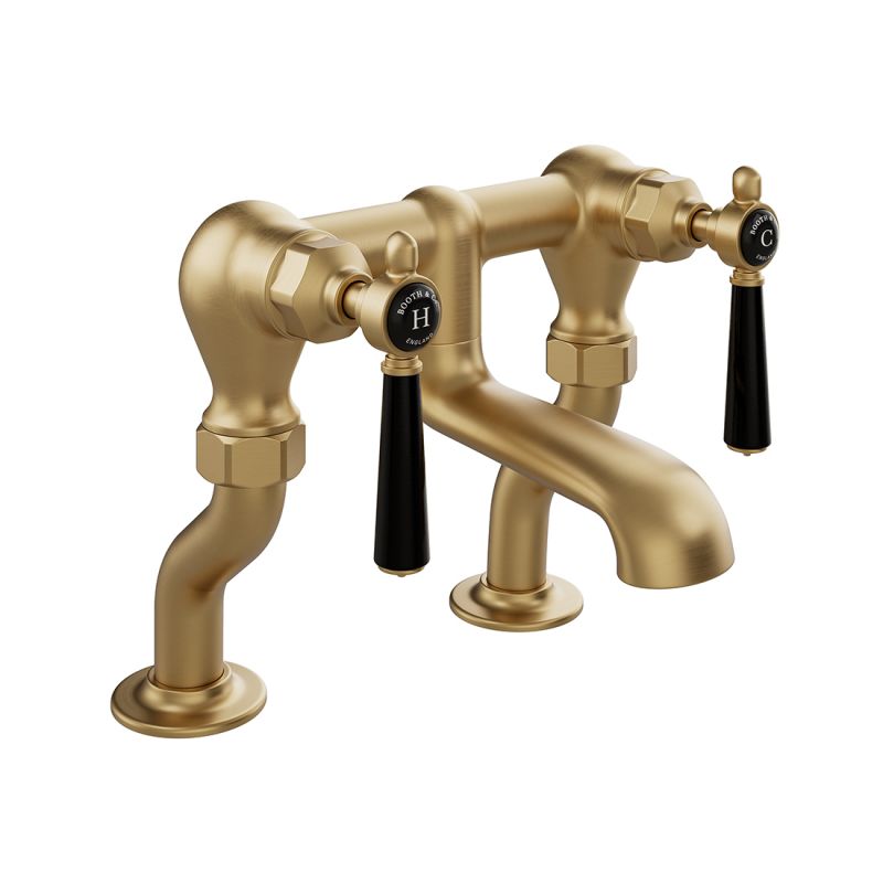 Booth & Co. Axbridge bath filler tap withlever handles, finished in brushed brass with black ceramic accents.