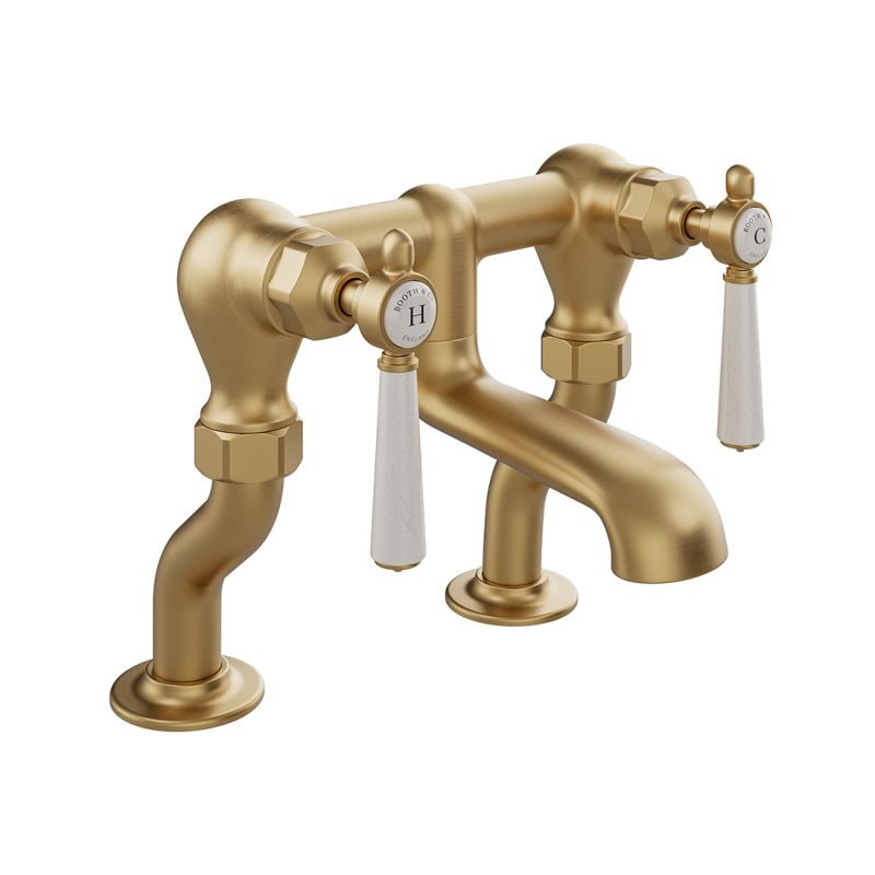 Booth & Co. Axbridge bath filler tap withlever handles, finished in brushed brass with crackled off-white ceramic accents.